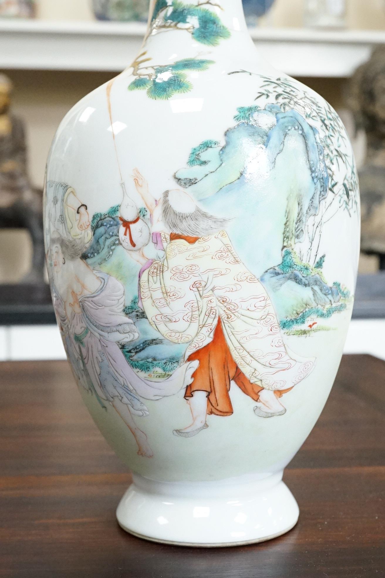 A Chinese famille rose ‘Liu Hai’ bottle vase, Qianlong six character seal mark but Republic period